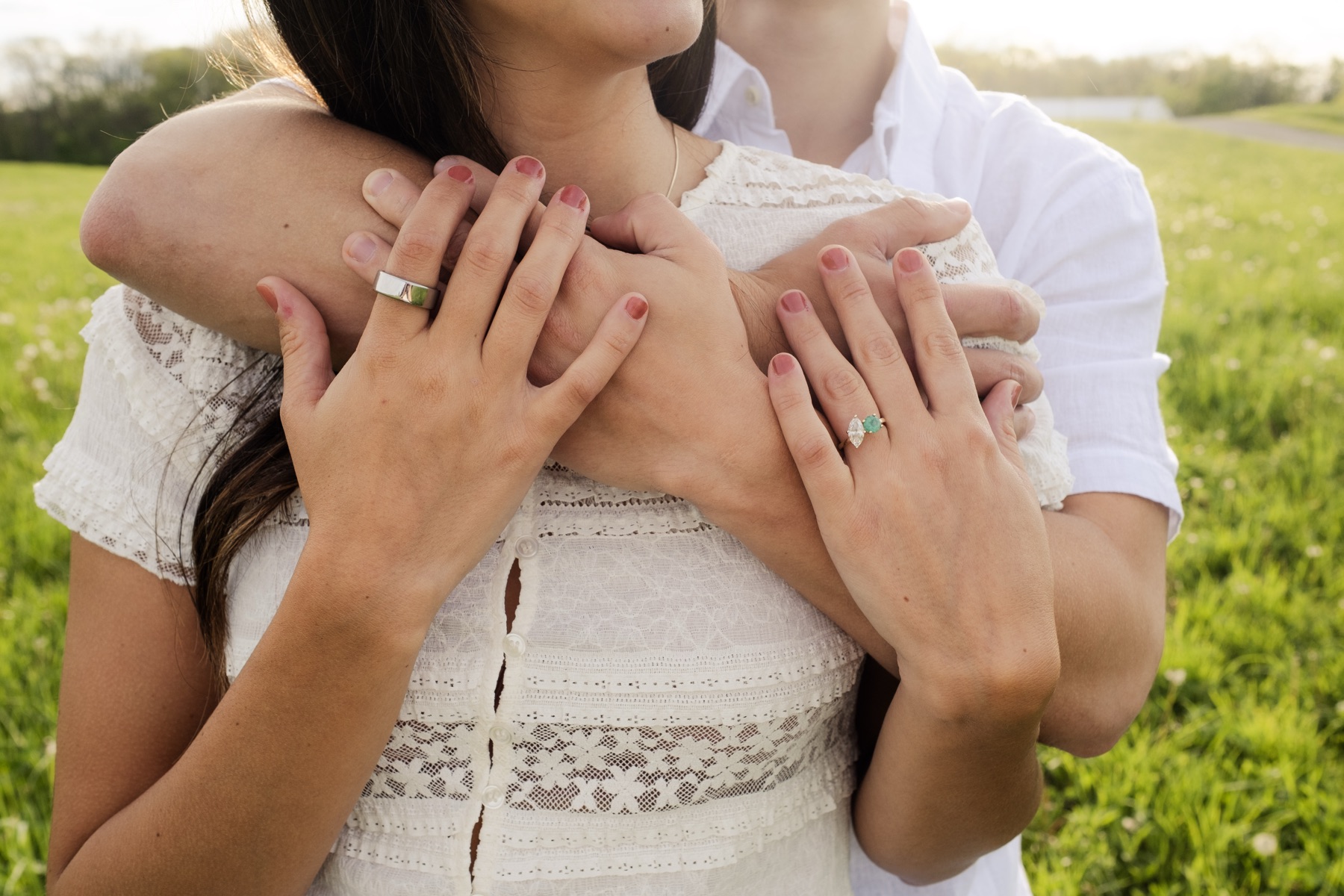 Couple embracing, hands on shoulders