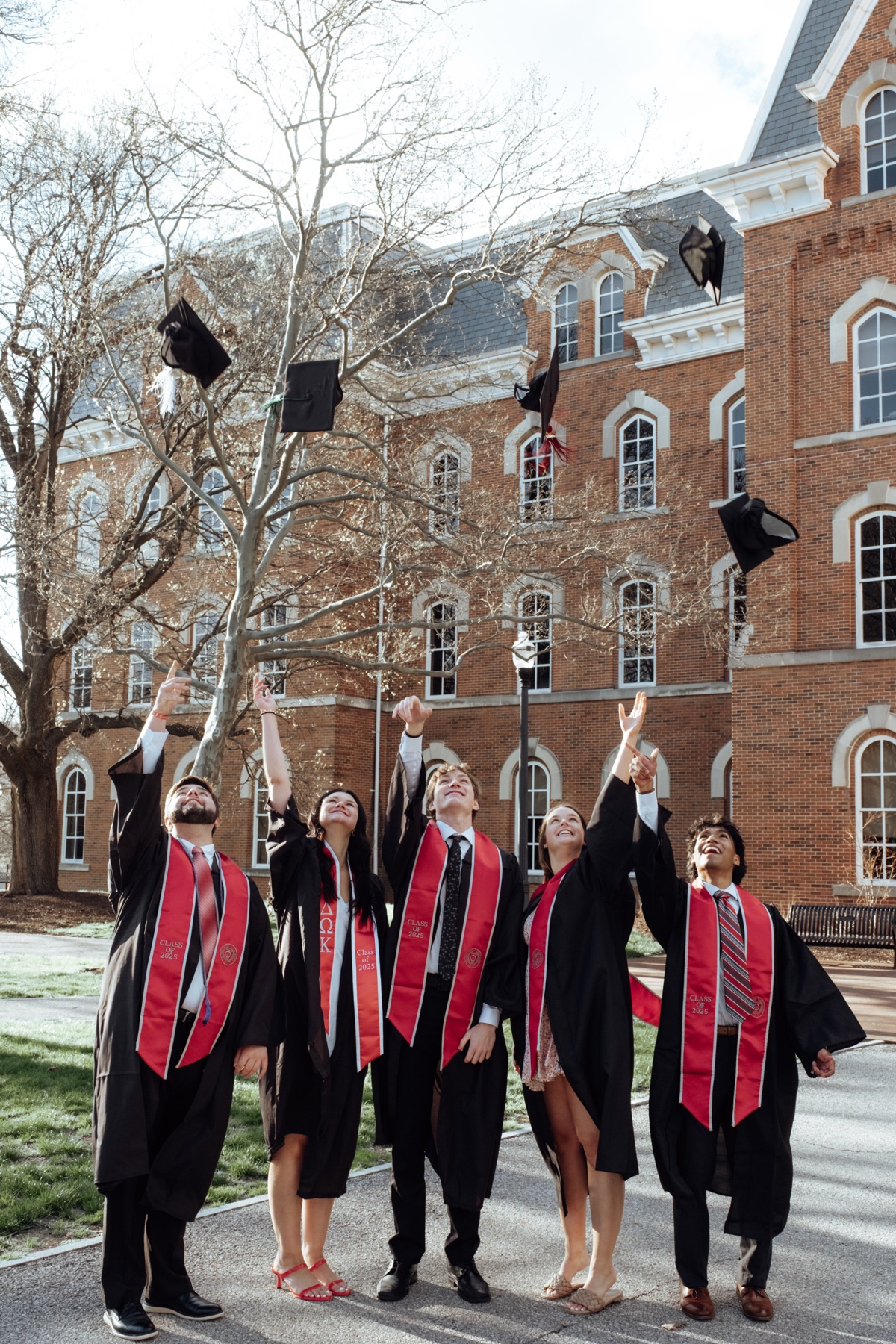 Graduates throwing caps in the air
